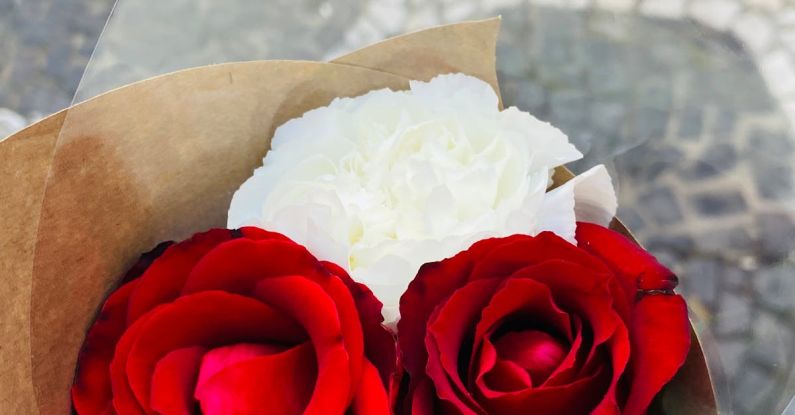 Personalized Gift - A person holding a bouquet of red roses